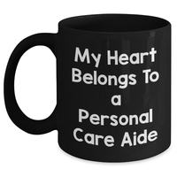 Load image into Gallery viewer, Funny Personal Care Aide Gifts from Men to Friends - My Heart Belongs To A Personal Care Aide Black Coffee Mug for Dad, Him, or Coworkers on Father&#39;s Day - Main
