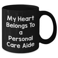 Load image into Gallery viewer, Funny Personal Care Aide Gifts from Men to Friends - My Heart Belongs To A Personal Care Aide Black Coffee Mug for Dad, Him, or Coworkers on Father&#39;s Day - Additional
