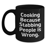 Load image into Gallery viewer, Funny Cooking Humor Gifts from Friends, Valentine's Unique Cooking Mugs for Coffee Lovers, Black Ceramic Mug with 'Cooking Because Stabbing People Is Wrong' Quote - Main
