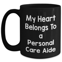 Load image into Gallery viewer, Funny Personal Care Aide Gifts from Men to Friends - My Heart Belongs To A Personal Care Aide Black Coffee Mug for Dad, Him, or Coworkers on Father&#39;s Day - Main
