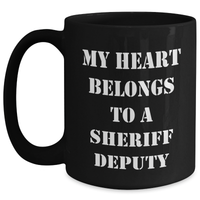 Load image into Gallery viewer, Funny Sheriff Deputy Gifts from Men to Sheriff Deputy on Father&#39;s Day - Black Coffee Mug with &#39;My Heart Belongs To A Sheriff Deputy&#39; Quote - Main
