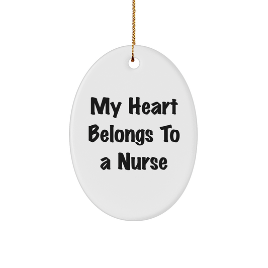 Funny Nurse Gifts for Christmas: 'My Heart Belongs To A Nurse' Oval Ornament from Gifts for Her, Perfect for Coworkers or Family - Image 1