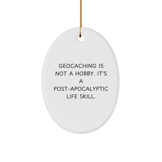 Geocaching Gifts for Friends, Funny Oval Ornament for Christmas, 'Geocaching Is Not A Hobby. It's A Post-apocalyptic Life Skill.' - Image 1
