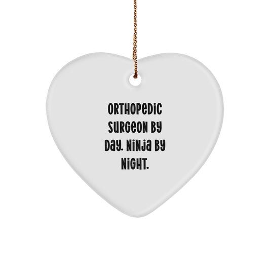 Orthopedic Surgeon Gifts from Friends and Family, Heart Ornament for Christmas Unique Presents, 'Orthopedic Surgeon By Day. Ninja By Night. ' - Image 1