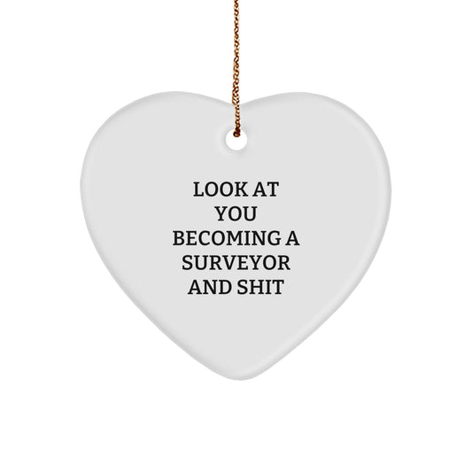 Funny Surveyor Gifts for Men from Friends, 'Look At You Becoming A Surveyor And Shit' Heart Ornament for Christmas - Image 1