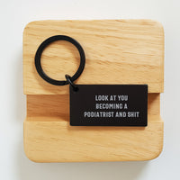 Load image into Gallery viewer, Funny Podiatrist Keychain Gifts from Friends to Becoming a Podiatrist, Look At You Shit, 1.57 x 0.87 inches Stainless Steel Keychain for Graduation - Image 2
