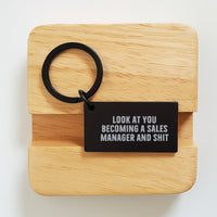 Load image into Gallery viewer, Funny Sales Manager Keychain Gifts from Friends, Coworkers, or Family for Graduation, 'Look At You Becoming A Sales Manager And Shit' - Image 2
