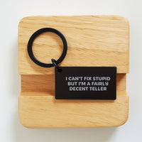 Load image into Gallery viewer, Funny Teller Keychain Gifts for Friends from Family, Black Stainless Steel Keychain with Engraved I Can't Fix Stupid But I'm A Fairly Decent Teller Message, Birthday Unique Ideas - Image 2
