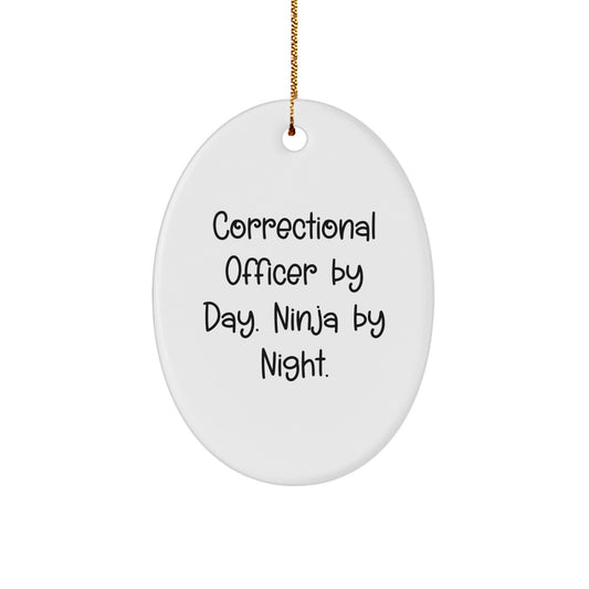 Funny Correctional Officer Gifts from Friends for Men, Oval Ornament, Correctional Officer By Day. Ninja By Night. - Image 1