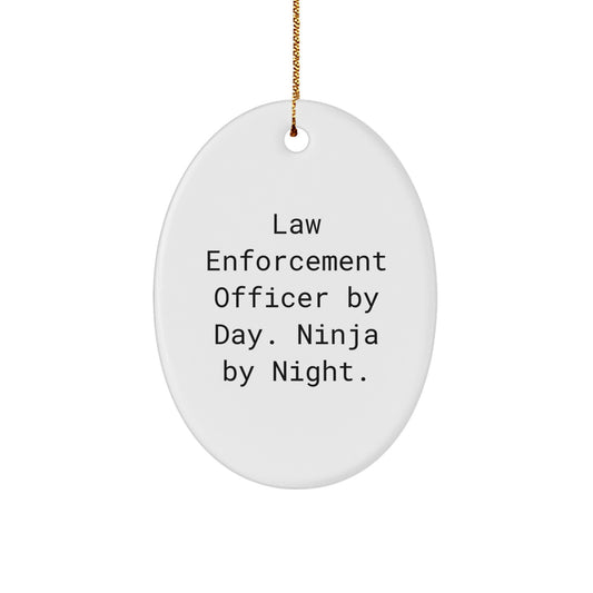 Funny Law Enforcement Officer Gifts from Friends for Christmas Unique Presents - Oval Shaped Ornament with Law Enforcement Officer By Day. Ninja By Night. - Image 1