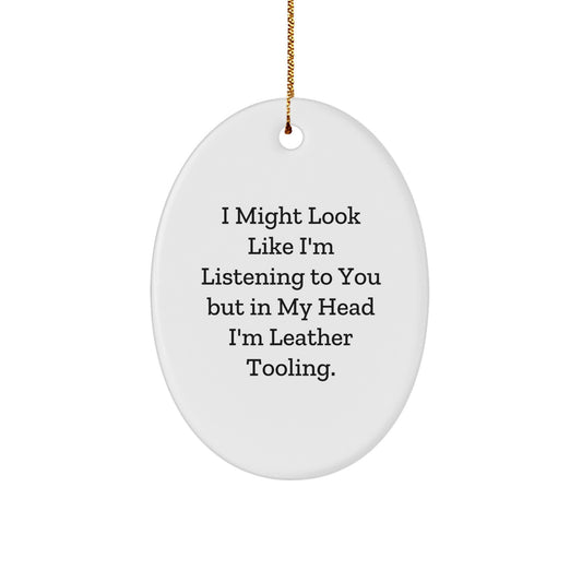 Funny Leather Tooling Oval Ornament, I Might Look Like I'm Listening To You But In My Head I'm Leather Tooling. Gifts from Friends to Family for Christmas Unique Gifts - Image 1