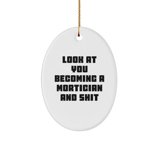 Funny Mortician Gifts from Friends to Morticians - Oval Ornament with Look At You Becoming A Mortician And Shit Quote, Christmas Unique Gifts - Image 1