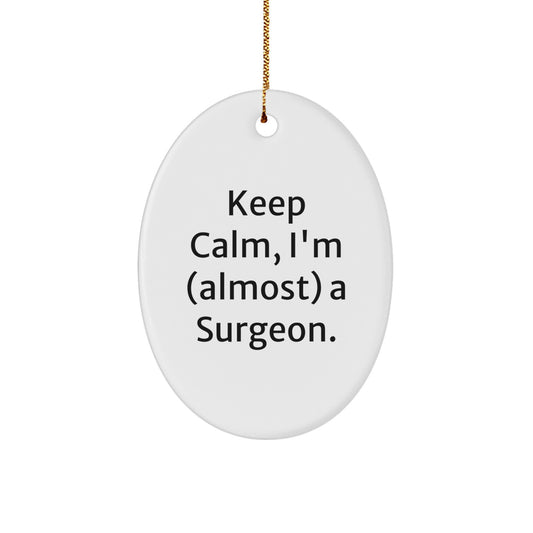 Funny Surgeon Oval Ornaments for Christmas Unique Gifts from Friends to Family Members - 'Keep Calm, I'm (almost) A Surgeon' - Image 1